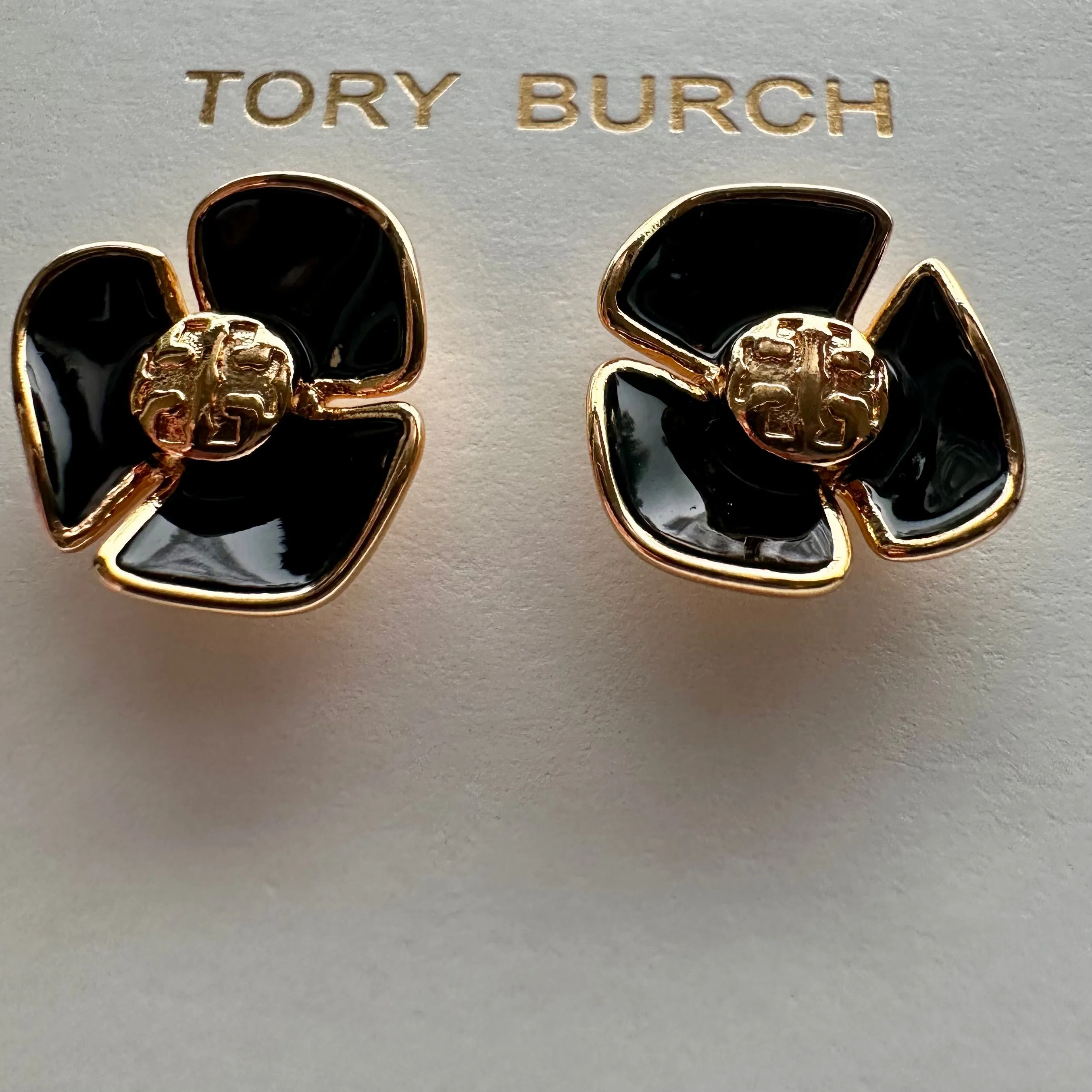 Product image for New Tory Burch Fleur Flower Stud Earrings Black Enamel/Gold on TB earring card