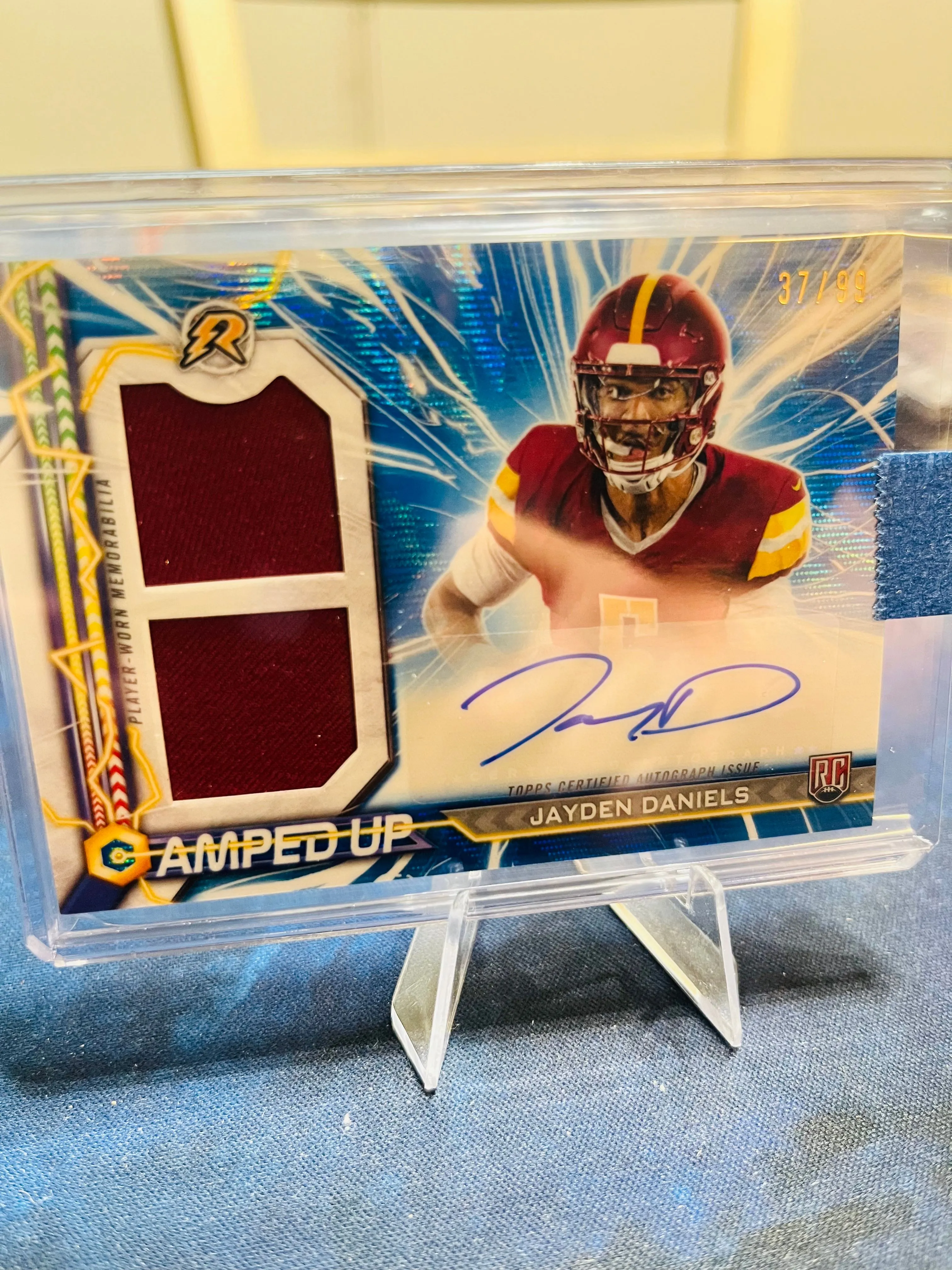 Product image for Jayden Daniels Numbered Blue Dual Patch RPA /99 Resurgance Amped Up Topps