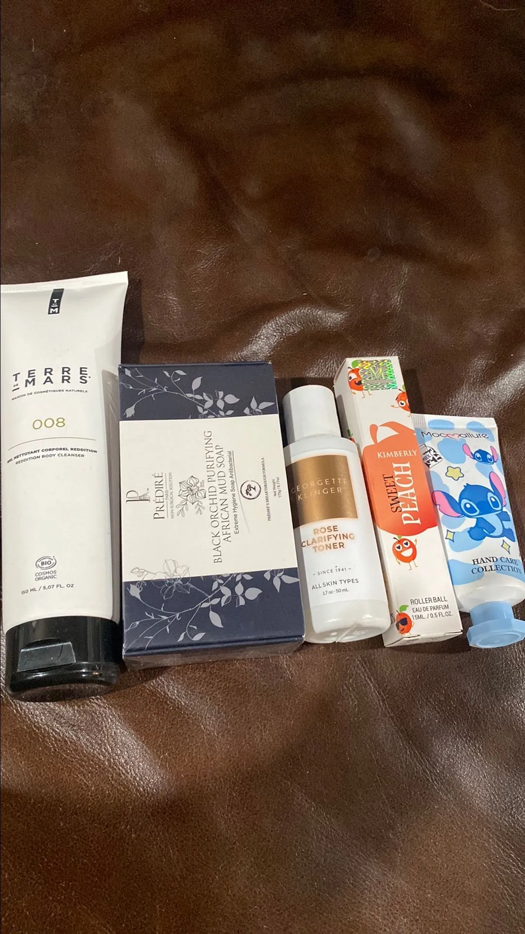 Product image for Skincare, body cleanser, perfume roll, and hand lotion bundle