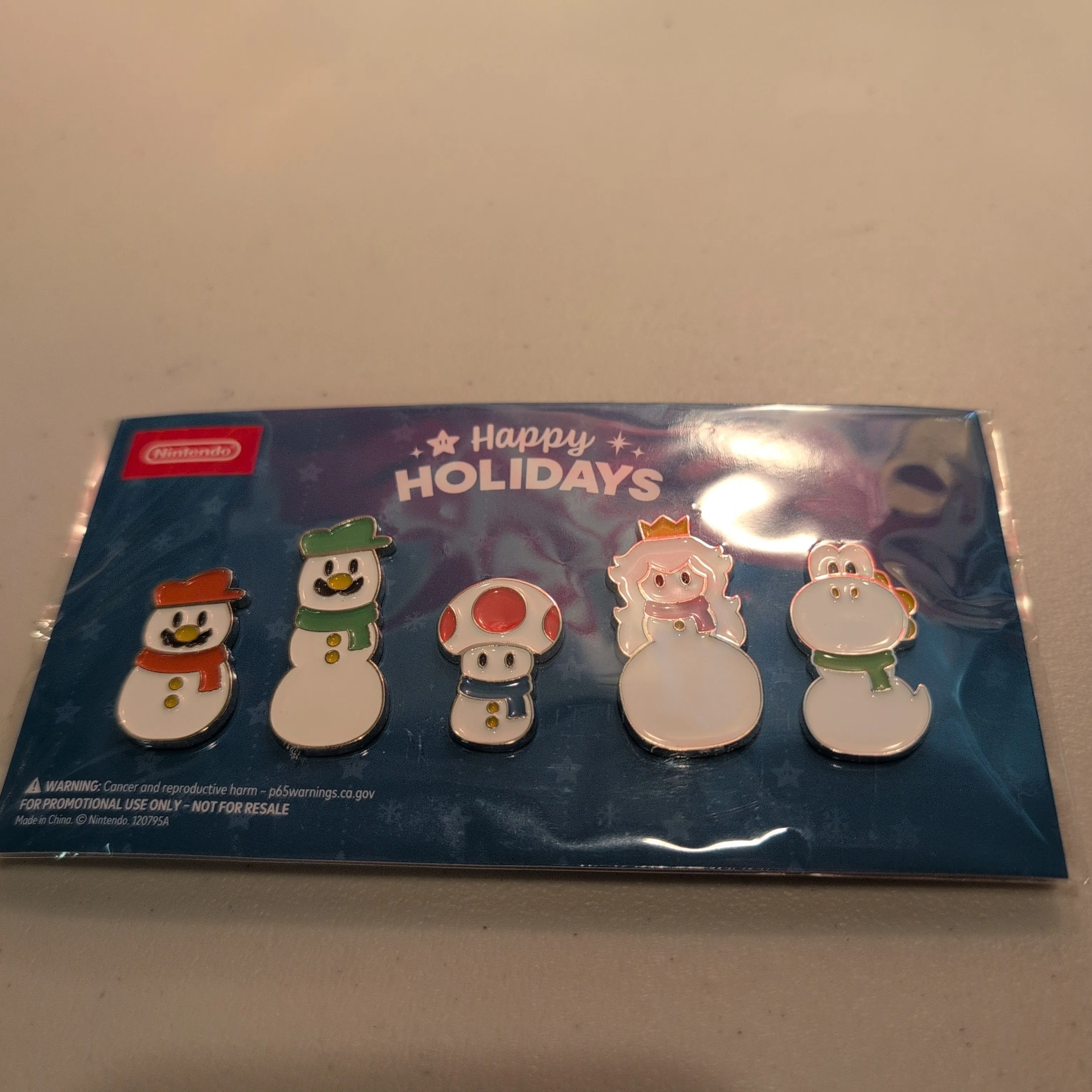 Product image for Mario and friends Snowmen Holiday pin set. GameStop exclusive.