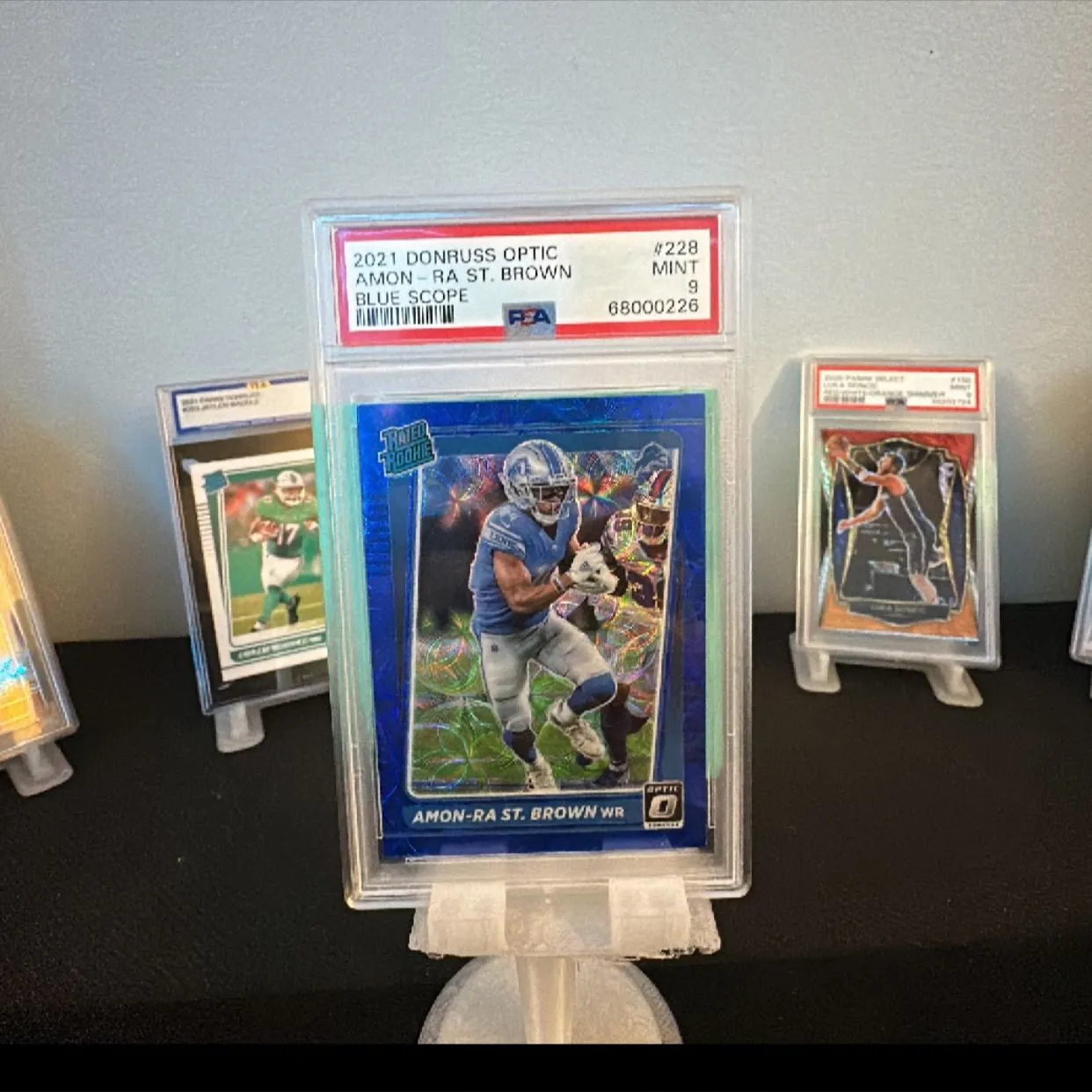 Product image for 2021 Panini Donruss Optic Amon-Ra St. Brown 228 Blue Scope PSA MINT 9