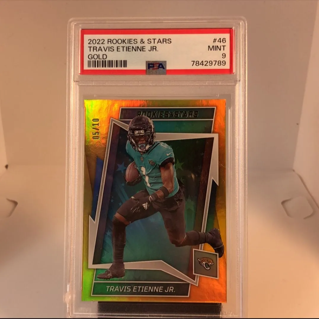 Product image for 2022 Panini Rookies & Stars Travis Etienne Jr. 46 Gold PSA MINT 9