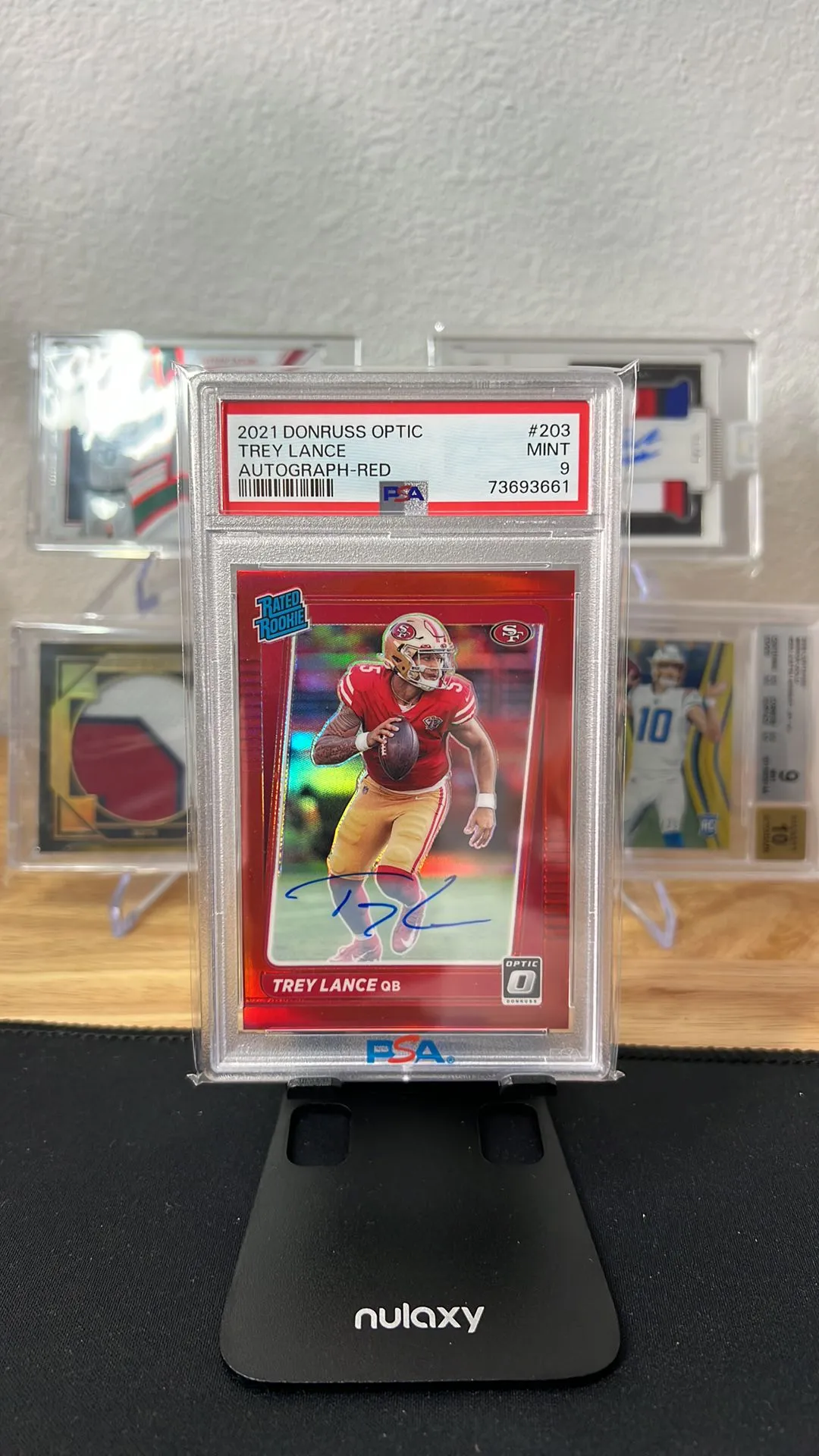 Product image for 2021 Panini Donruss Optic Trey Lance 203 Autograph-Red PSA MINT 9