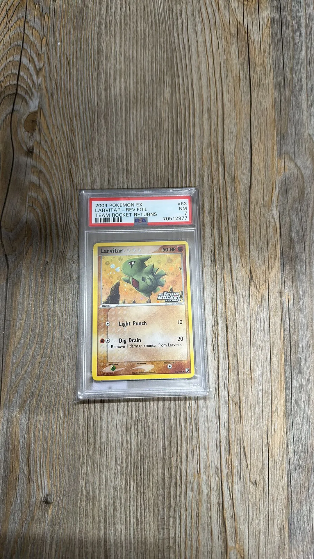 Product image for 2004 Pokemon Ex Team Rocket Returns Larvitar-Rev.Foil Team Rocket Returns PSA NM 7