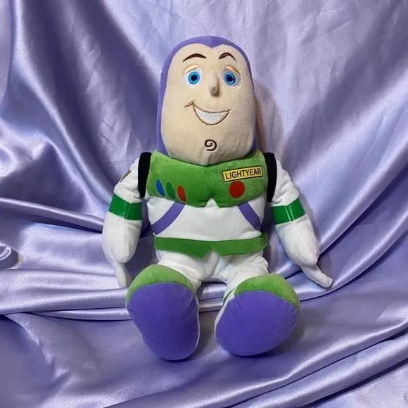 Product image for Disney Pixar Buzz lightyear plush toy - it has a jet pack on the back
li…