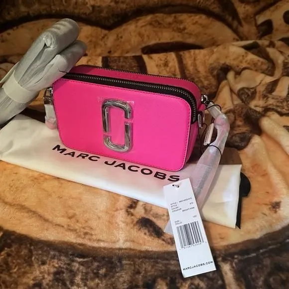 Product image for Marc Jacobs pink “snapshot”camera bag full inclusion.