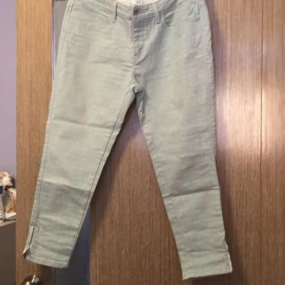 Product image for LEVI’S skinny jeans with mint green writing. Size 33