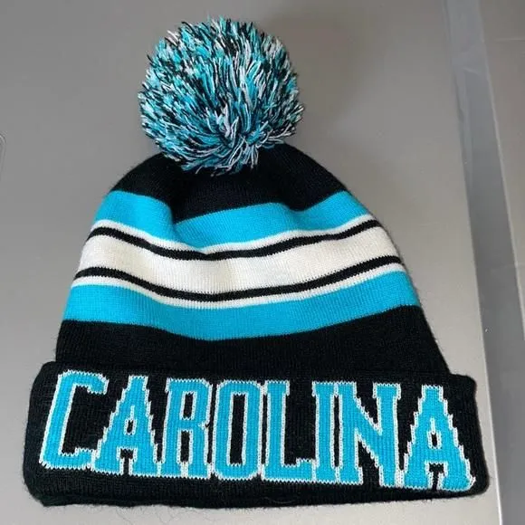 Product image for Carolina Panthers Striped Poof Top Knit Beanie Hat OS