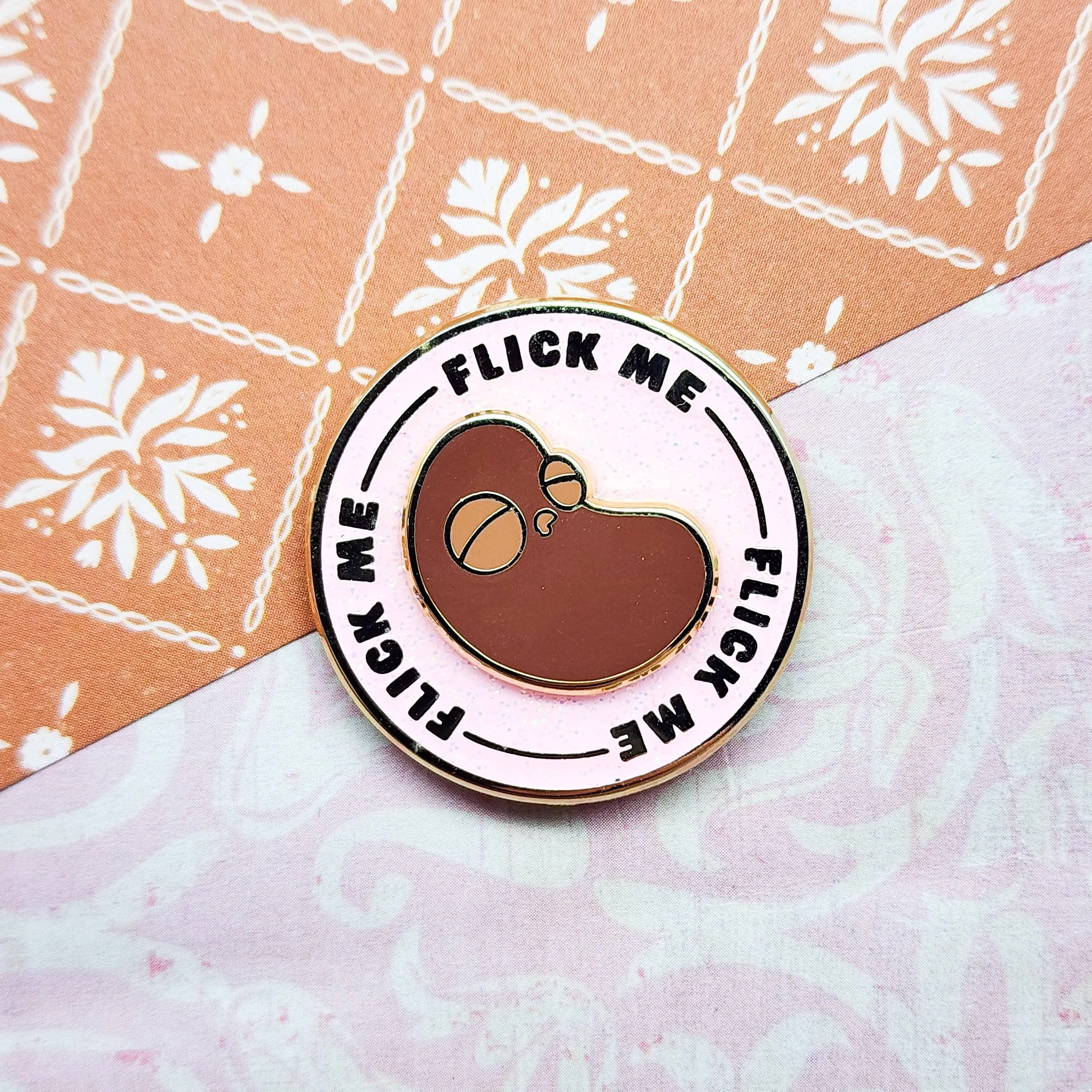 "Flick The Bean" Spinning Enamel Collectible Pin by Toku Arts
