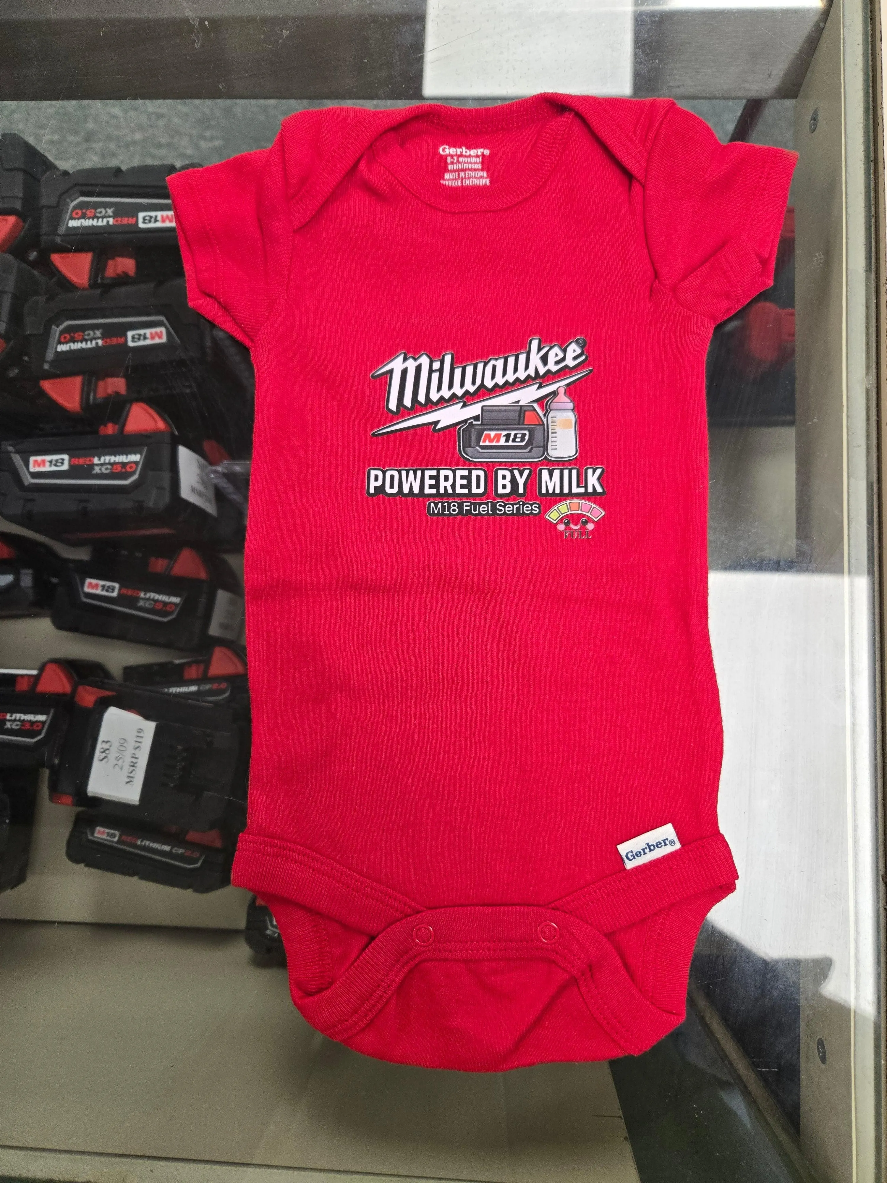 POWERED BY MILK BABY ONESIE