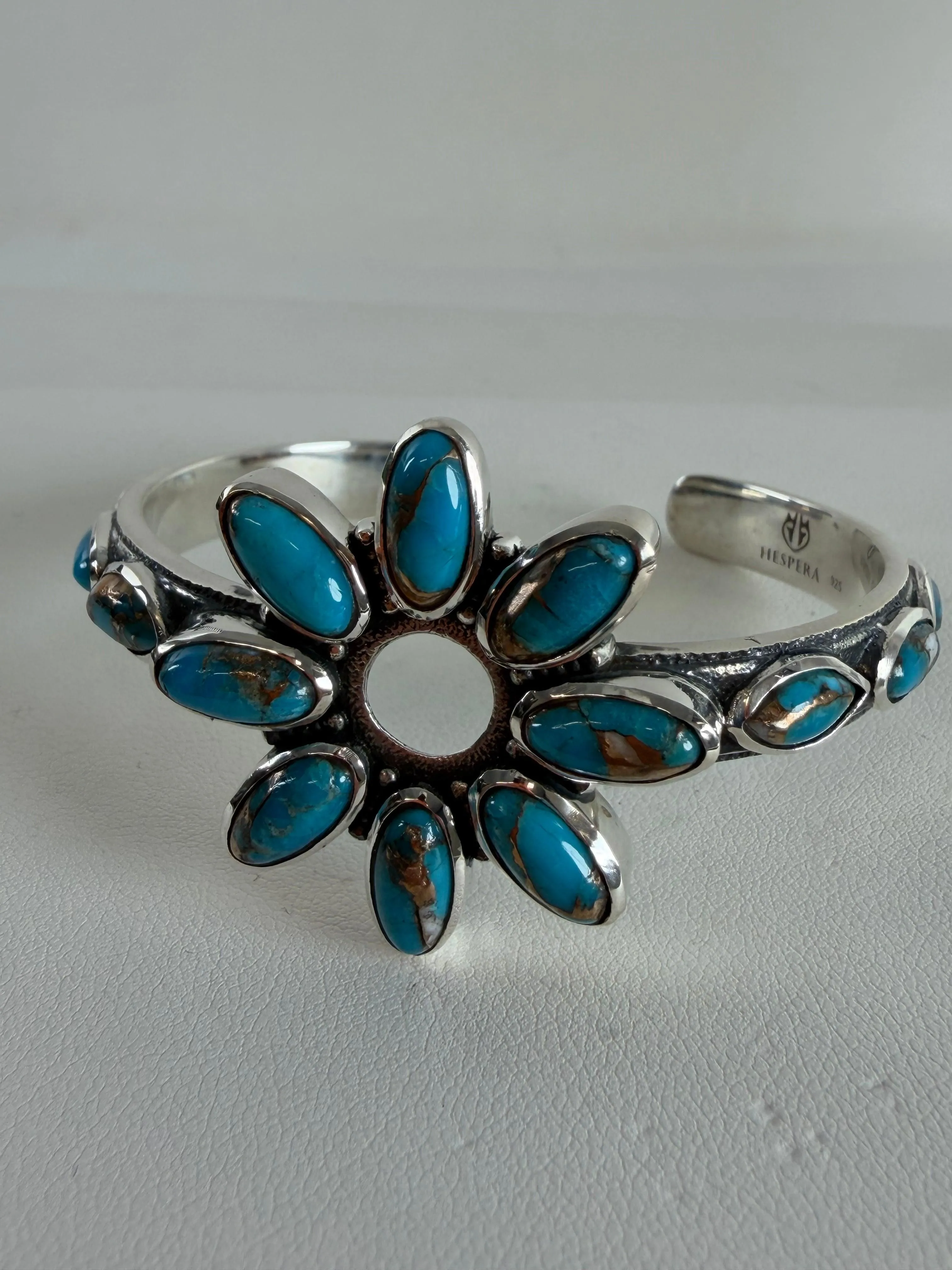 SPINY TURQUOISE ADJUSTABLE FLOWER CUFF BY HESPERA (JR 64)