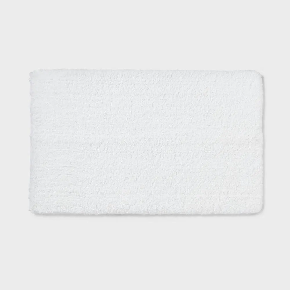 New without box - Size: 24"x40" - Threshold Tufted 40x24" Rectangle Bath Rug High Pile Spa Plush White