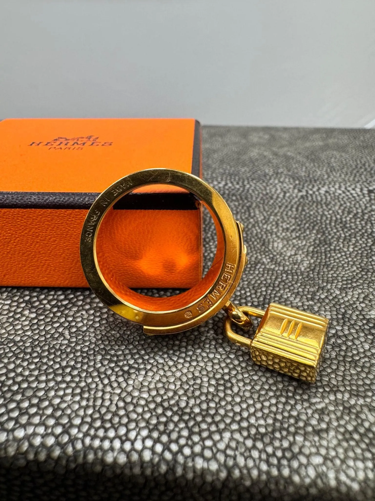 Hermes Gold Tone And Black Kelly Lock Scarf Ring