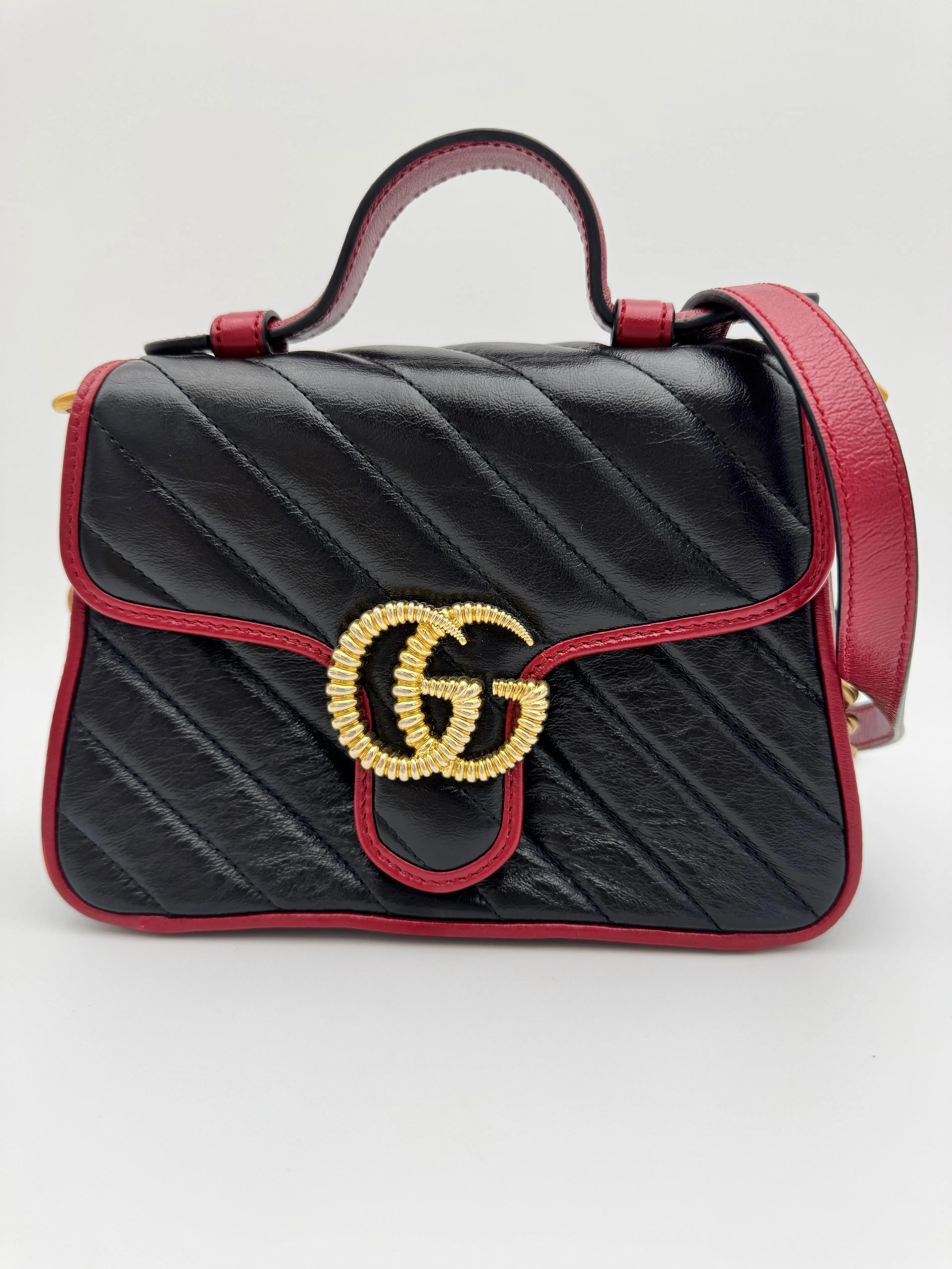 Gucci GG Marmont Torchon Mini Top Handle Bag - Black Quilted Leather with Cerise Red Trim