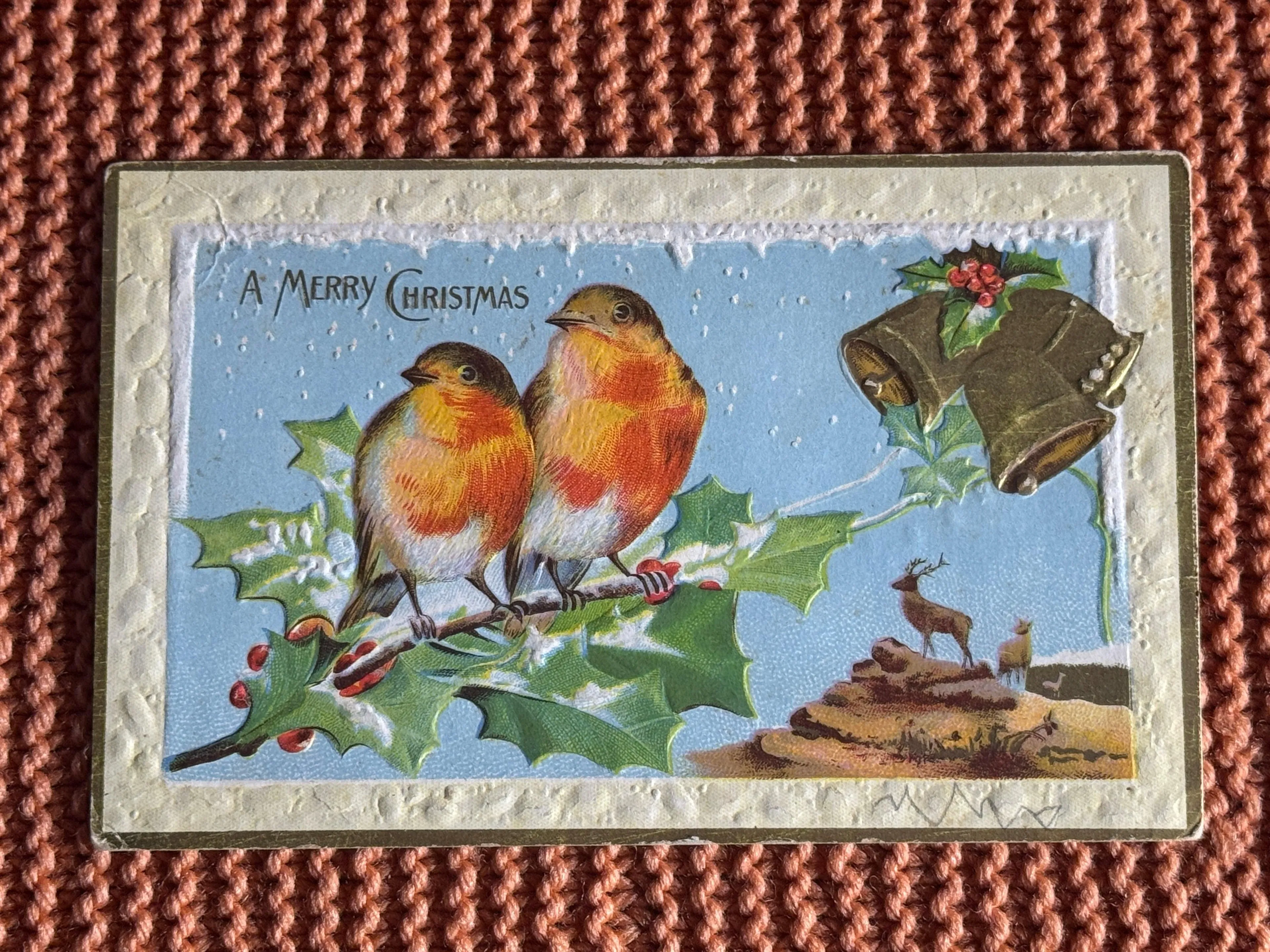 E48. Antique A Merry Christmas Birds Deer Bells Snow Embossed Gilt Postcard