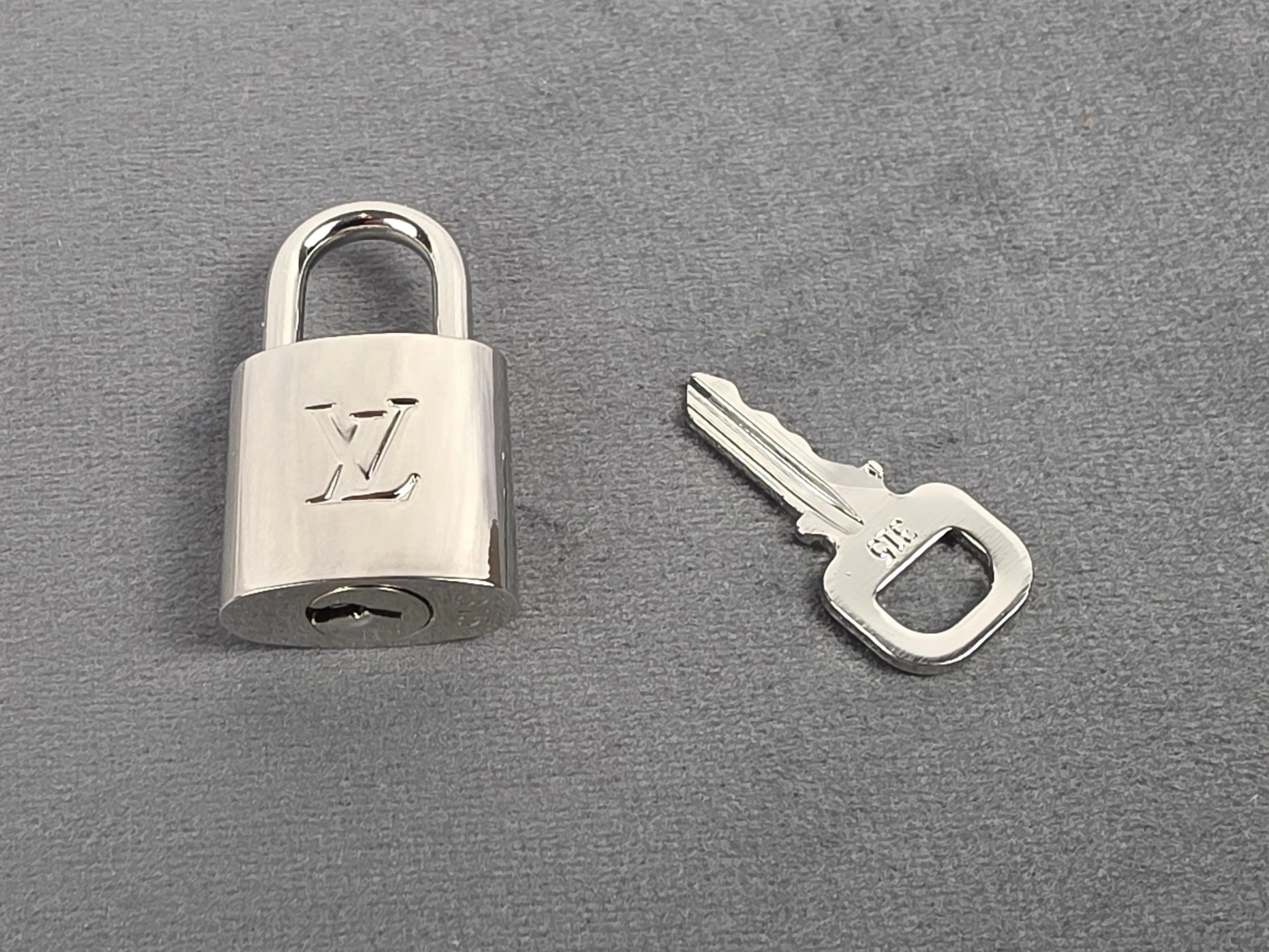 Authentic Louis Vuitton Silver Padlock & Key Set