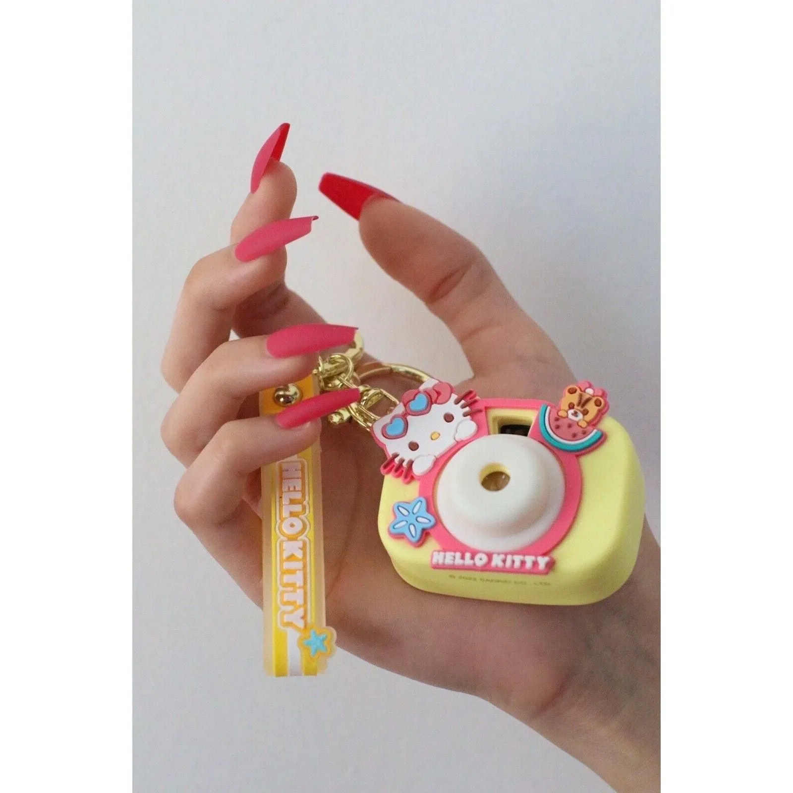 Product image for Hello Kitty Keychain Camera Projector (Yellow)