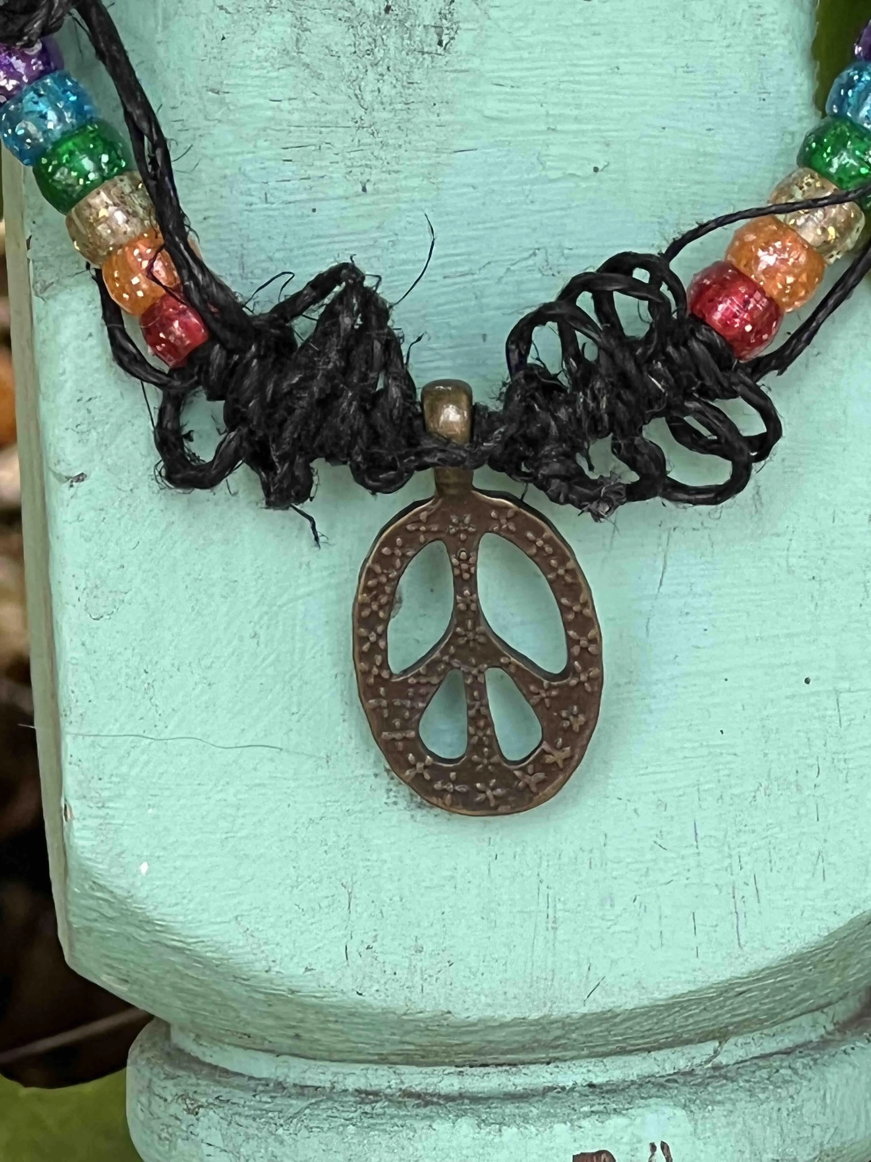 Product image for Rainbow Pride Peace Black hemp necklace by Christina Rietsch