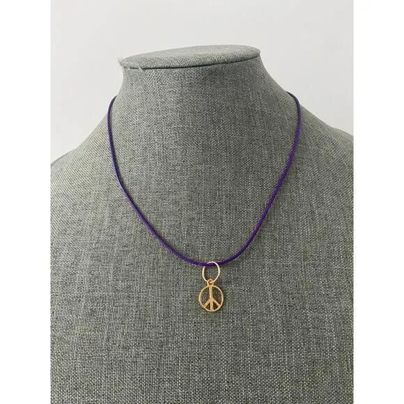 Product image for Gold tone peace sign pendant necklace