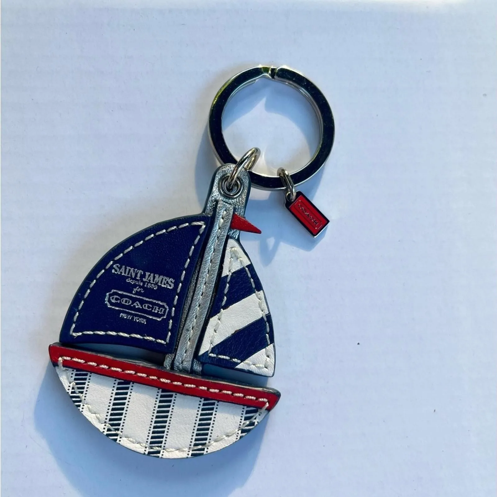 Product image for Coach Key Fob Navy and White Sailboat Dupuis 1889 for Coach New York.