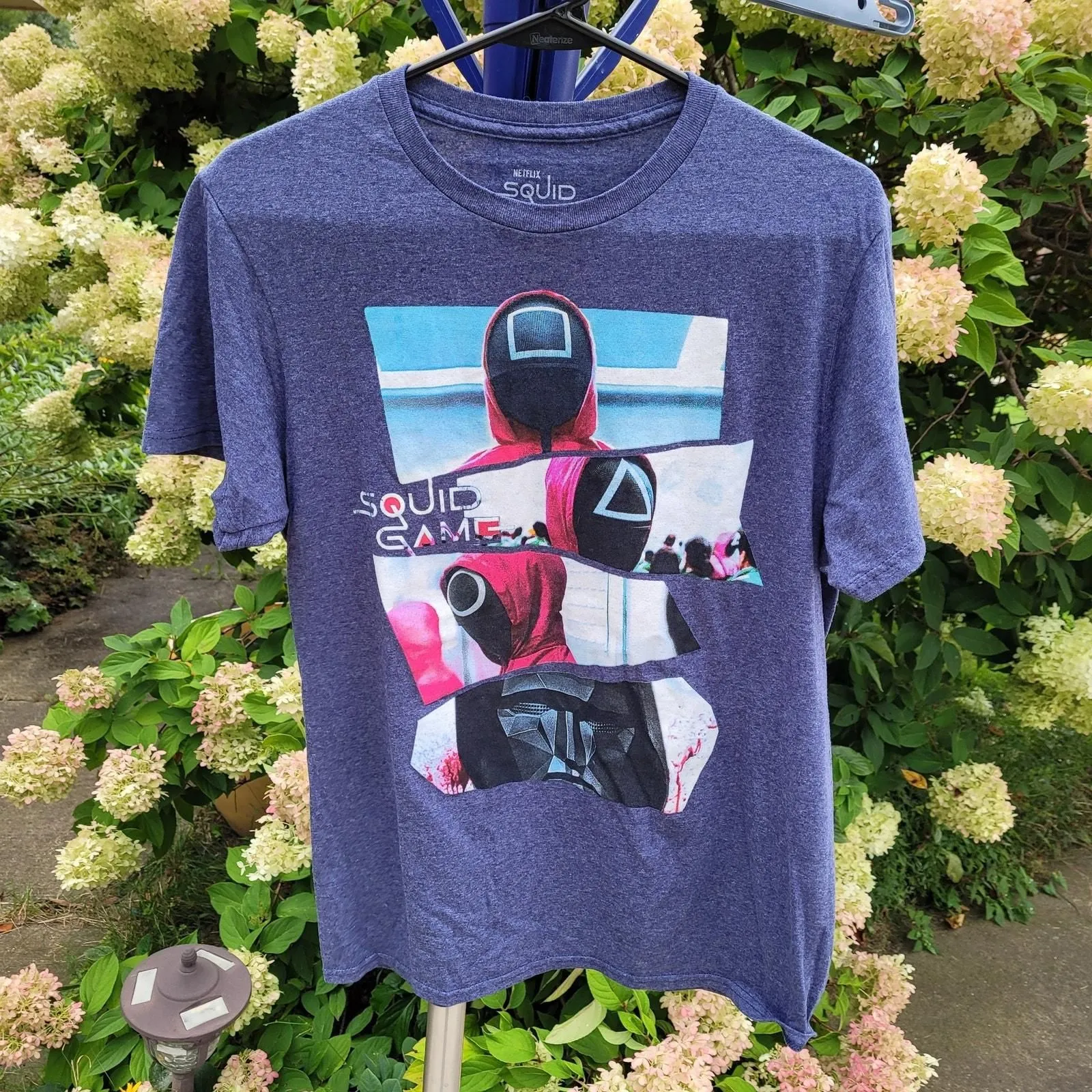 Product image for Netflix Squid Game Graphic T-shirt Masked Markers Hierarchy sz Med Heather Blue - pre-owned---good - Netflix
