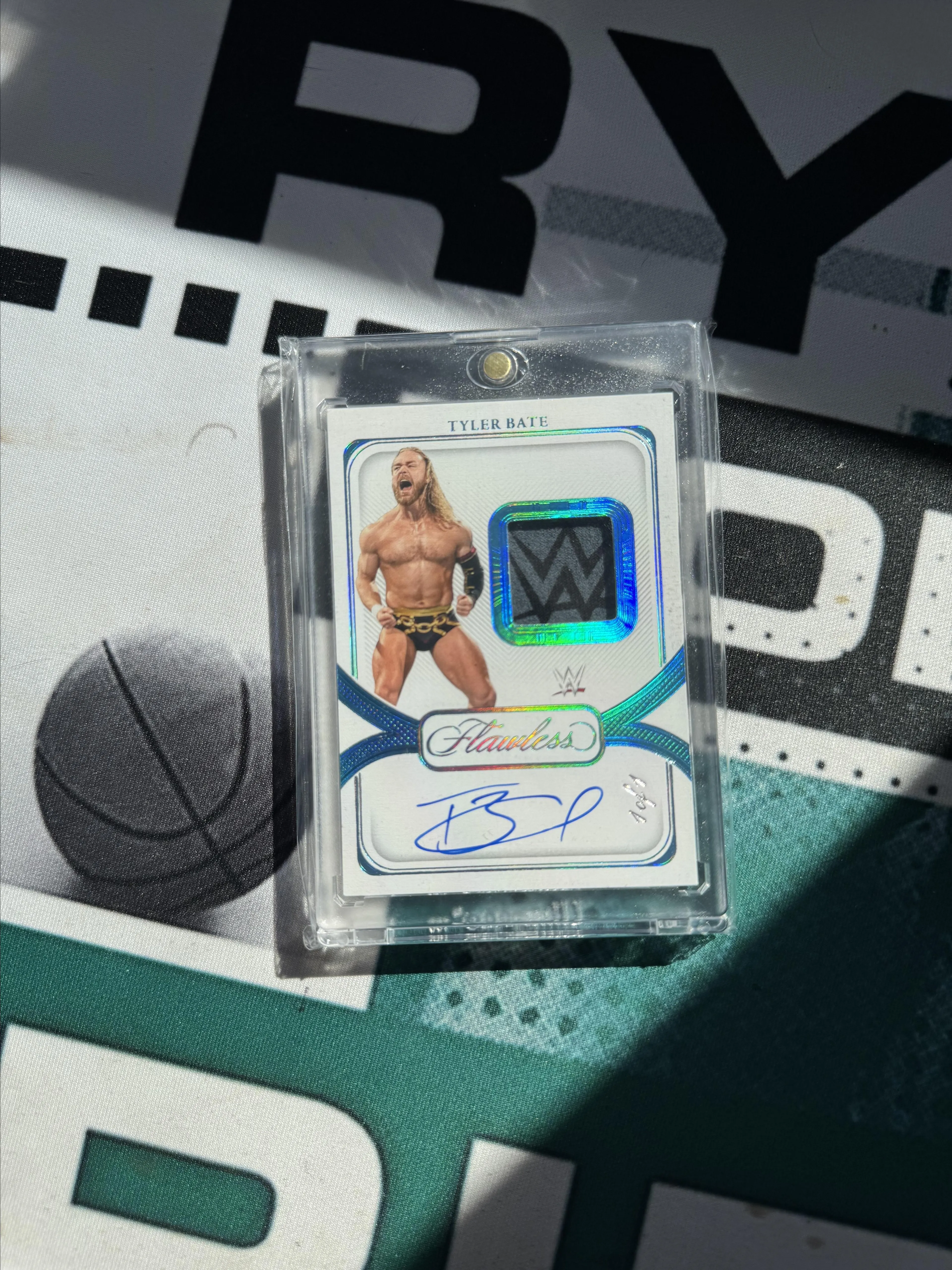 Product image for 2024 FLAWLESS TYLER BATE SIGNATURE PATCH AUTO 1/1 - Near Mint or Better - 2024 - WWE - SPTBT - Panini - Tyler Bate - Flawless - Signature Patch Auto Platnium WWE Logo 1/1