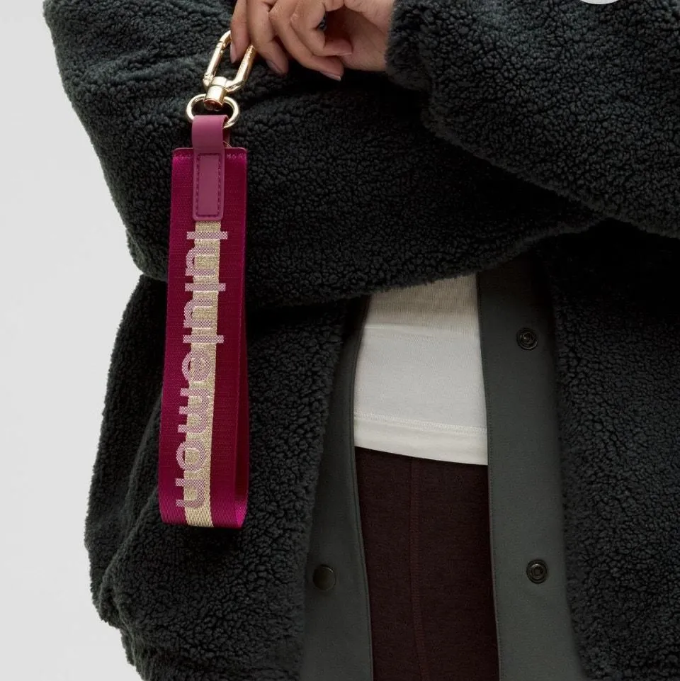 Product image for  Lululemon Never Lost Keychain Wordmark DeepLuxe/GoldBone NWT Retired