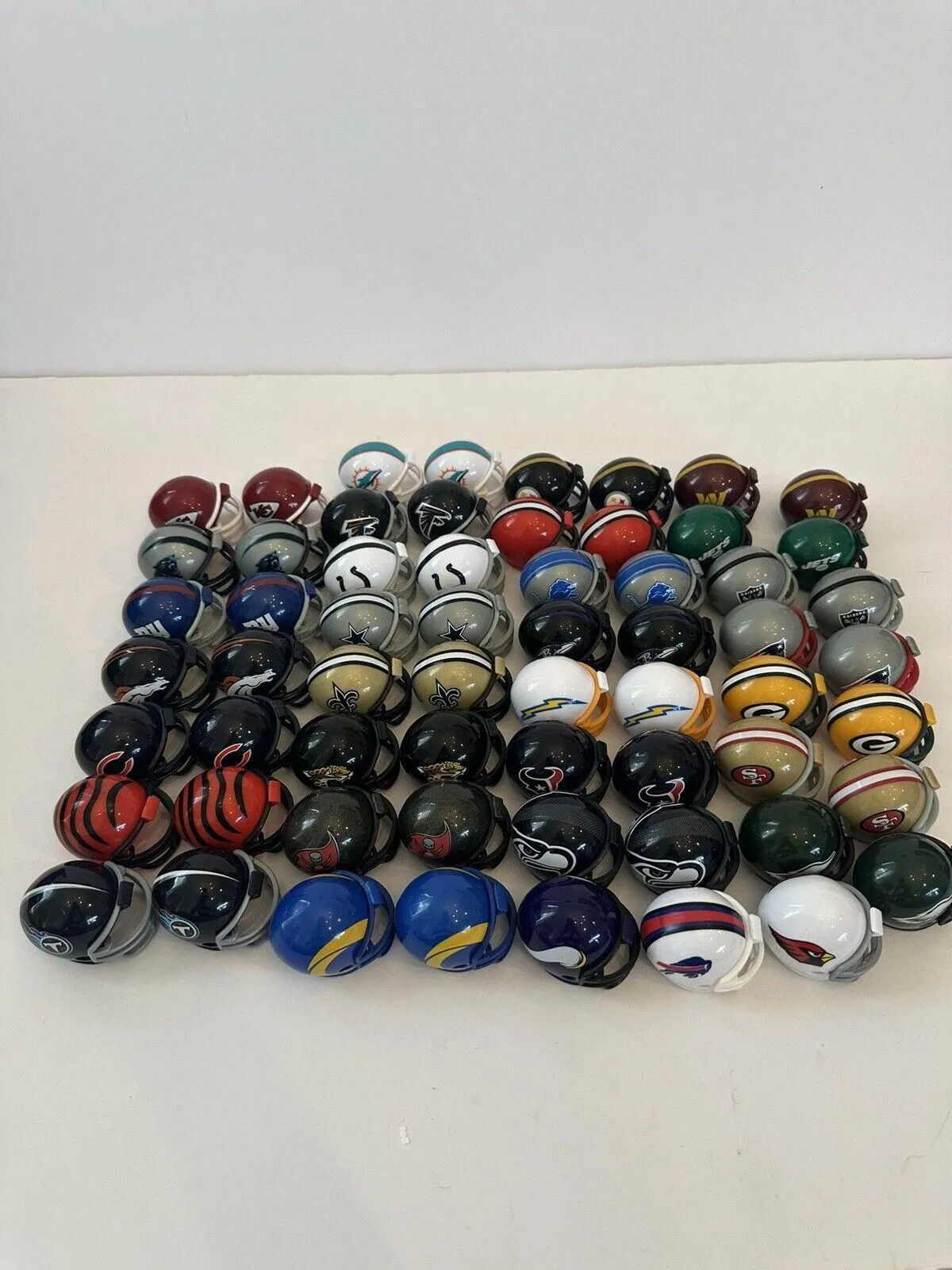 Product image for RIDDELL NFL FOOTBALL Gumball Sized 1 1/2” MINI HELMETS Lot Of 63 2023