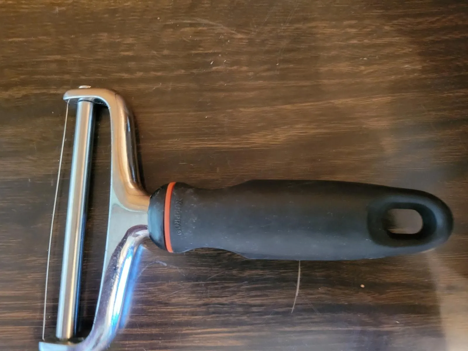 Product image for Norpor EZ Grip Stainless Steel Cheese Slicer - Black Handle - pre-owned---good
