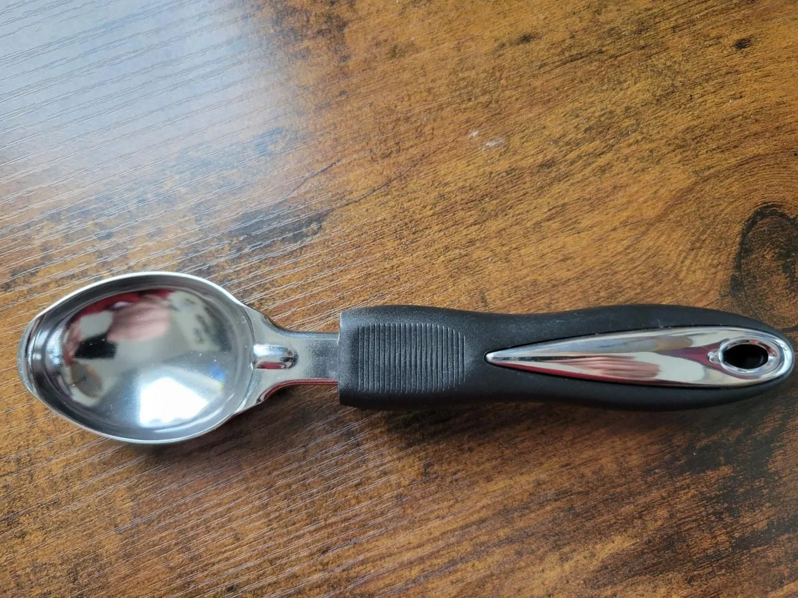 Product image for Stainless Steel Ice Cream Scoop w/Black Plastic Grip Handle - pre-owned---good