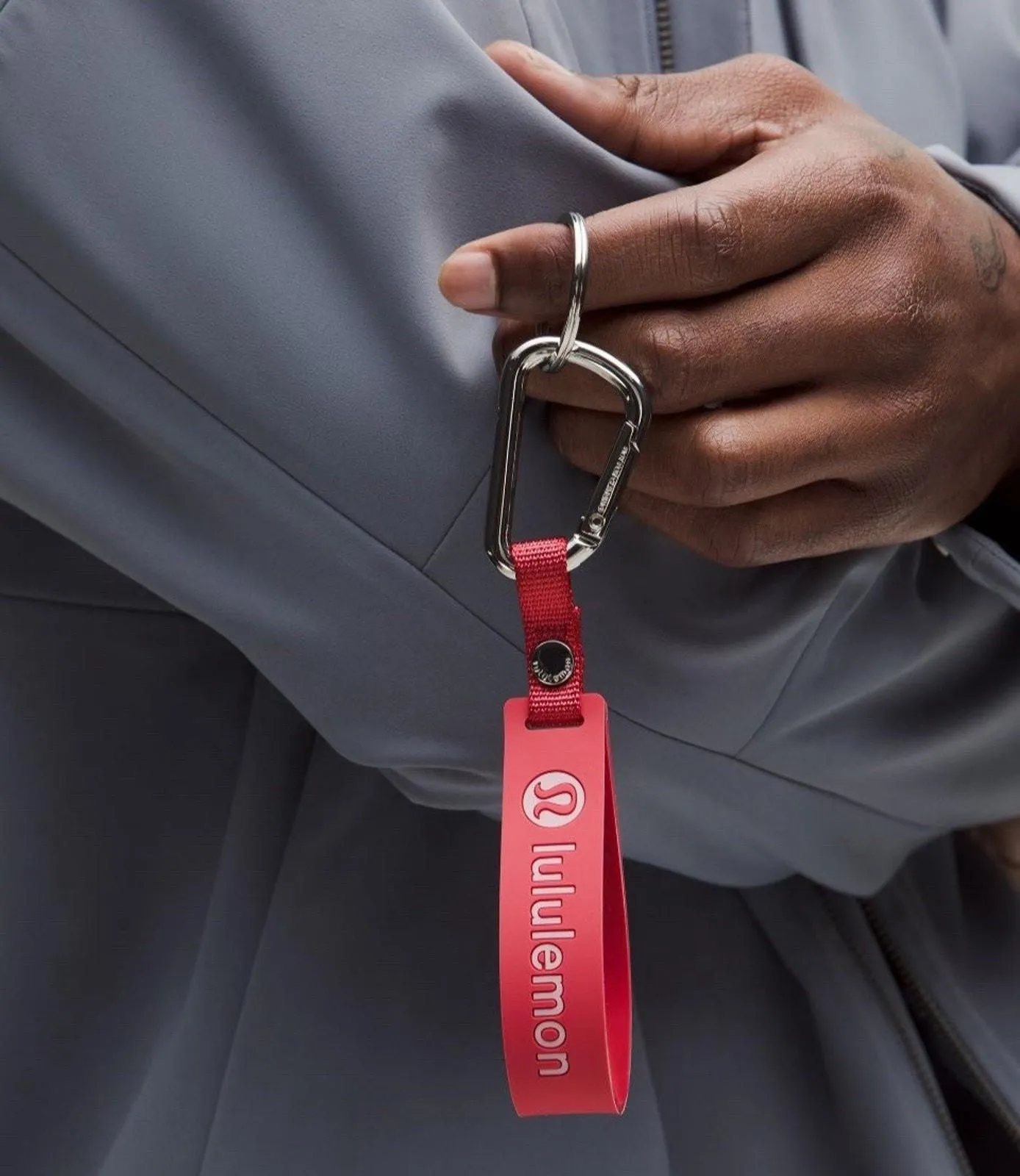 Product image for Lululemon Silicone Keychain Live In The Moment Desert Red/Pink Haze NWT