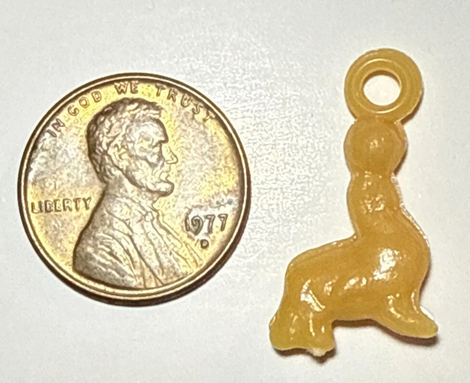 Product image for Vintage Cracker Jack Yellow Seal Celluloid Charm 1E
