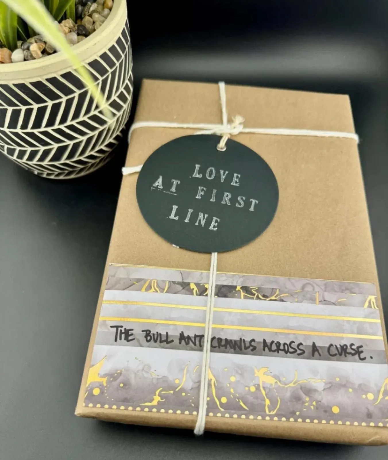 Product image for Love At First Line Book "The bull ant crawls across a curse."