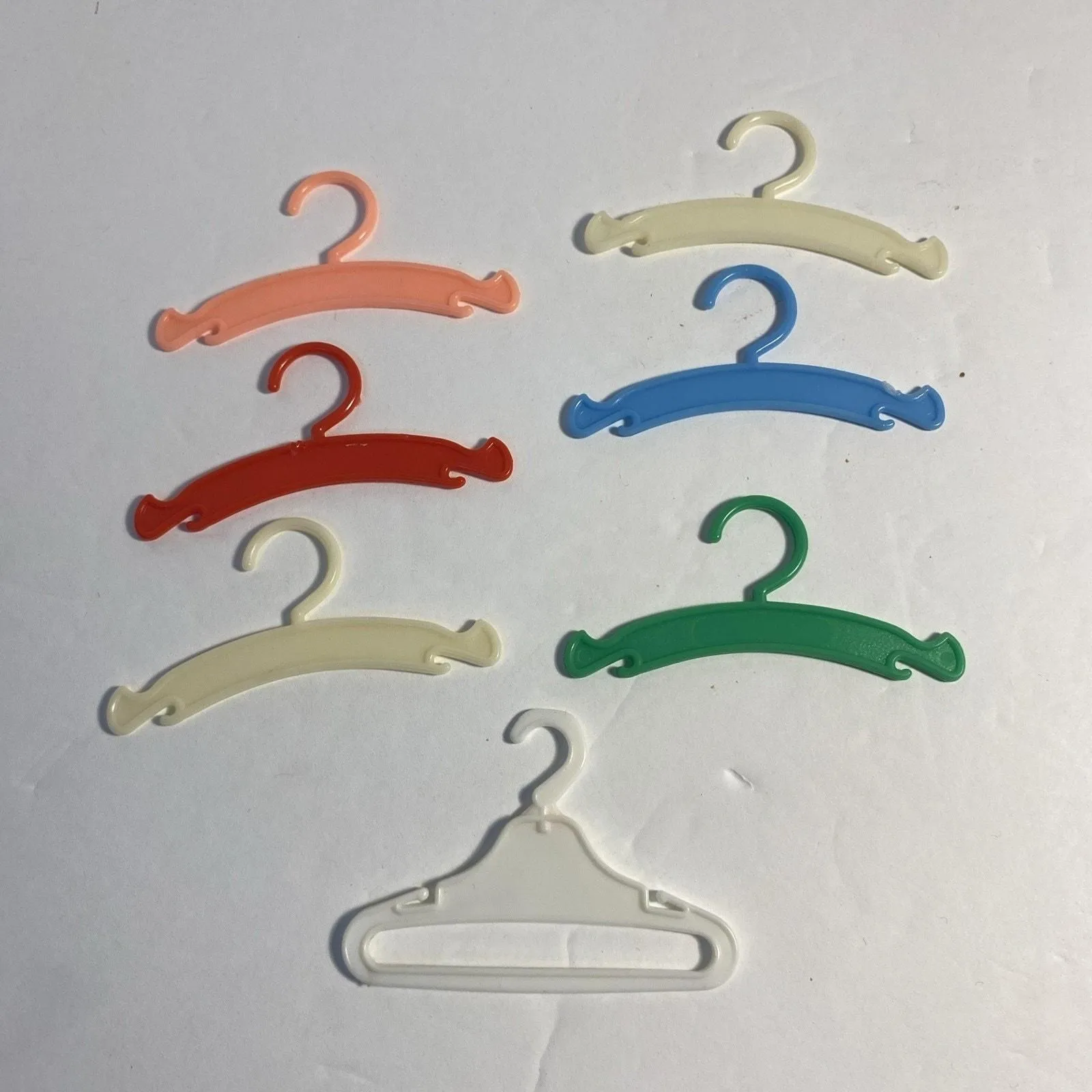 Product image for VTG Fashion Doll Hard Plastic Hangers Lot Of 7 1980s Blue White Green Red Peach