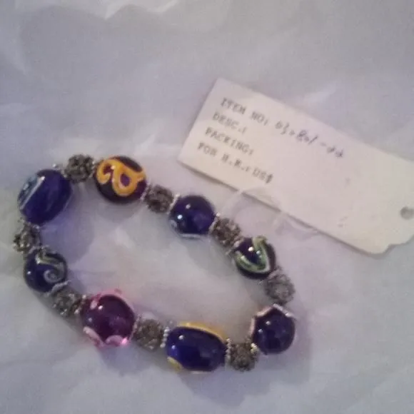 Product image for A beautiful bracelet with blue red beads with initials on them and silver beads