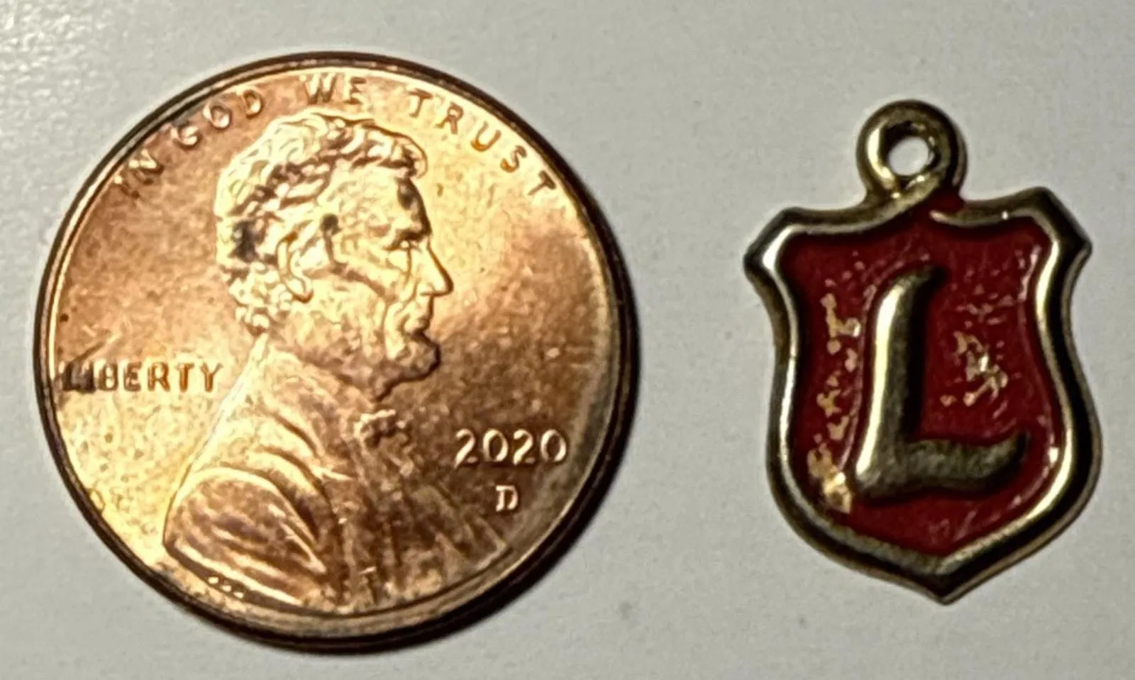 Product image for Vintage Metallic Cracker Jack L Plaque Charm 1L