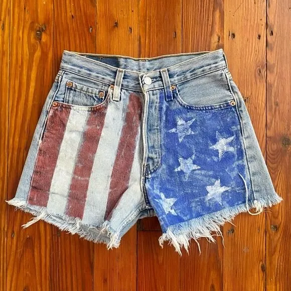 Product image for Vintage Levi’s 90s 501 American flag painted cut off jean shorts Sz 27