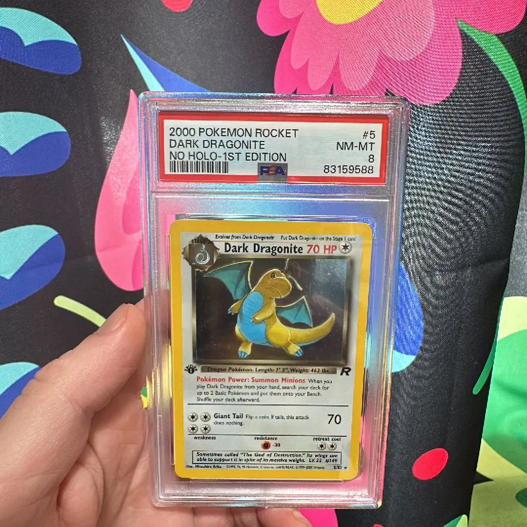 Retailer Pokémon Dark Dragonite 1st Edition Holo w/swirl PSA 7