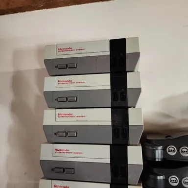one nes console, 2 controllers and cords
