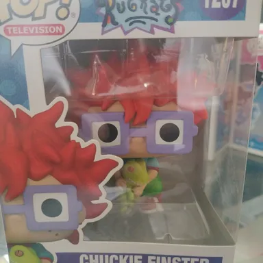 Chuckie Finster (with Reptar Doll)