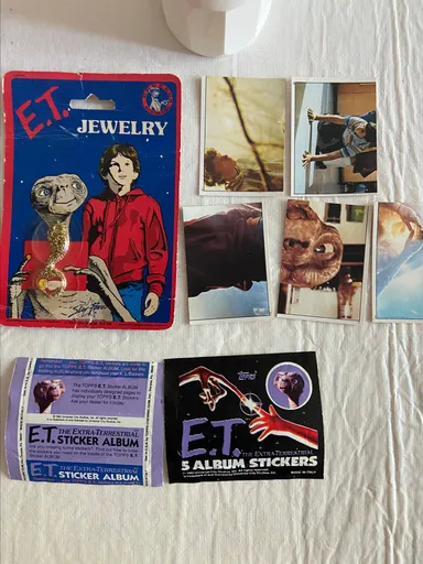 ET Vintage Cup, Sticker, and sealed Jewelry Lot
