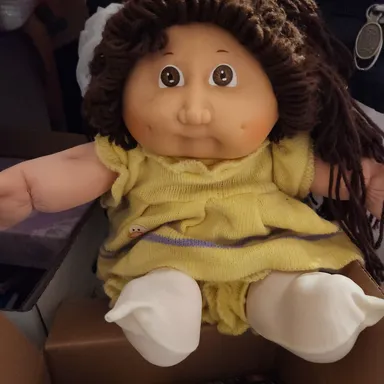 Cabbage Patch Doll with yellow knit outfit