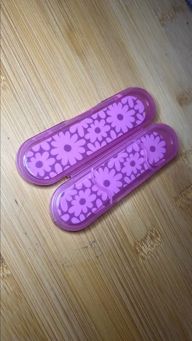 Set of 2 flower nail files in cases.