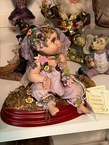 3. Clarence Maranuk porcelain doll on stand.