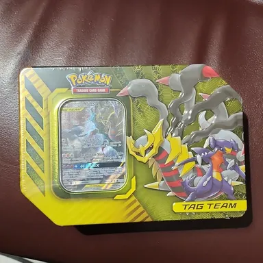 1 Pokémon TAG Team Factory Sealed Tin!!  Tin contains 4 Booster Packs + 1 Garchomp & Gratina Promo!!