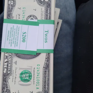 100 stack of $2 follar bills