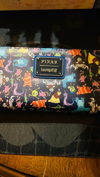 097 NWT Disney Loungefly Pixar Monsters Inc. wallet on screen