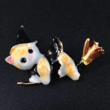 Cat wearing a witch hat and riding on a broom Halloween brooch