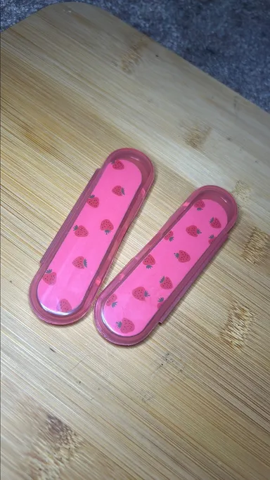 Set of 2 mini nail files in cases.