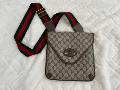 800.   Gucci supreme sling bag